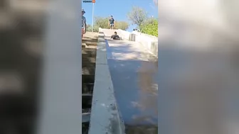 Man Transforms Into Accordion While Sliding Down Slide