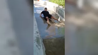 Man Transforms Into Accordion While Sliding Down Slide