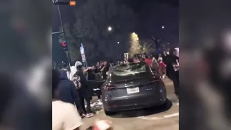 Scenes From Last Night's Chicago Mob Riots Show A Tesla Being Smashed