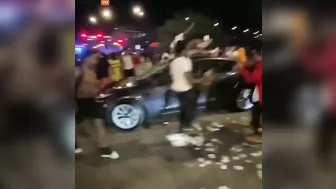 Scenes From Last Night's Chicago Mob Riots Show A Tesla Being Smashed