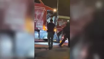 Two Police Officers Have A Tough Time With A Truck Driver Who Doesn't Seem To Be Concerned