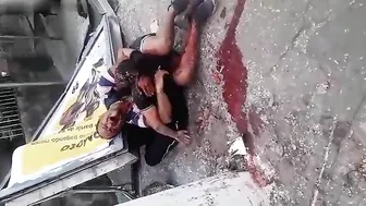 A Man Hugs The Body Of His Wife Who Died In The Accident