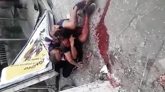 A Man Hugs The Body Of His Wife Who Died In The Accident