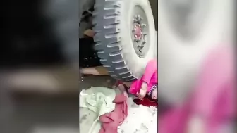 A Military Truck Drags A Woman Lying Under Its Wheels A(1)