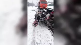 A Truck Pulls A Car That Was Hit By A Train And Is Filled With Dead Bodies