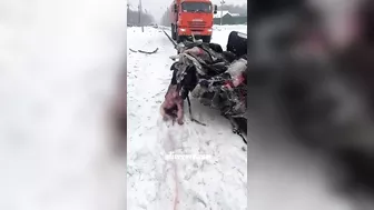 A Truck Pulls A Car That Was Hit By A Train And Is Filled With Dead Bodies