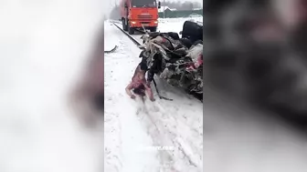 A Truck Pulls A Car That Was Hit By A Train And Is Filled With Dead Bodies