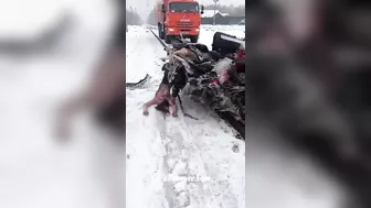 A Truck Pulls A Car That Was Hit By A Train And Is Filled With Dead Bodies
