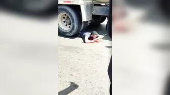 Gawkers Suggests A Man Lying Under The Wheels Of A Truck