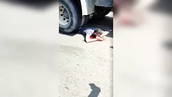 Gawkers Suggests A Man Lying Under The Wheels Of A Truck