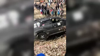 Guy Gets Too Close To A Mud Race And Gets Sandwiched Between Two Trucks