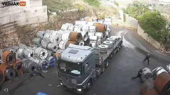 Man Tries To Stop Huge Steel Coil From Rolling Into Truck