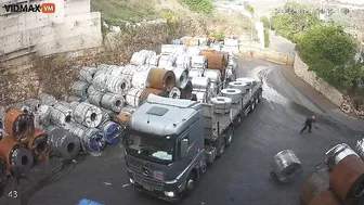 Man Tries To Stop Huge Steel Coil From Rolling Into Truck