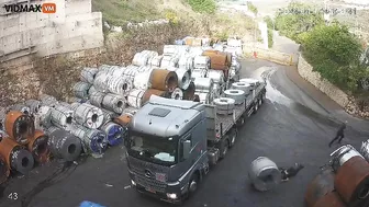 Man Tries To Stop Huge Steel Coil From Rolling Into Truck