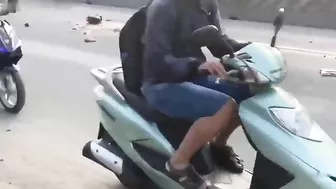 A Motorcyclist Falls Under The Wheels Of A Dump Truck. Vietnam