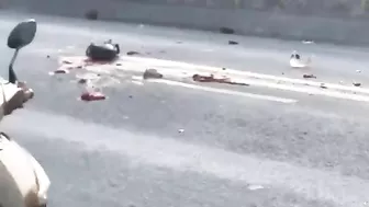 A Motorcyclist Falls Under The Wheels Of A Dump Truck. Vietnam