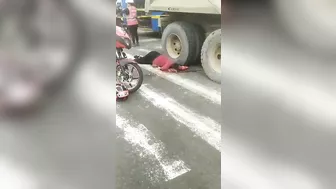 Motorcyclist's Head Crushed By Truck Tire, But Helmet Still Intact