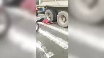 Motorcyclist's Head Crushed By Truck Tire, But Helmet Still Intact