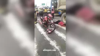 Motorcyclist's Head Crushed By Truck Tire, But Helmet Still Intact