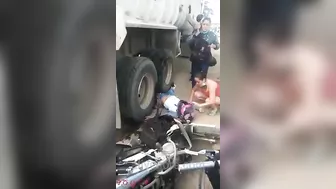 Motorcyclist's Legs Crushed By Truck Wheel