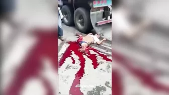 A Man's Body Lies Broken Under The Wheels Of A Truck