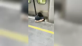 Man Squeezed Between Platform And Train