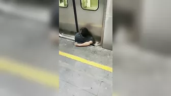 Man Squeezed Between Platform And Train