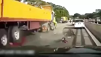 The Moment The Motorcyclist Fell Under The Wheels Of A Tractor