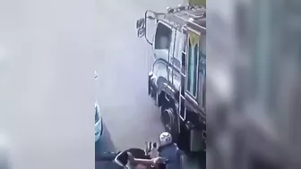 A Motorcyclist Was Pinned Under A Truck After It Ran Over His Legs