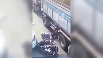 A Motorcyclist Was Pinned Under A Truck After It Ran Over His Legs