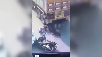 A Motorcyclist Was Pinned Under A Truck After It Ran Over His Legs