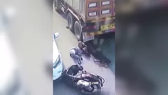 A Motorcyclist Was Pinned Under A Truck After It Ran Over His Legs