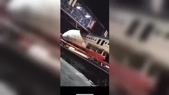 Truck Carrying Plane Body Hits Pedestrian Bridge
