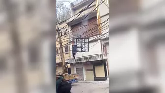 Witnesses Try To Pull Out The Body Of The Worker Who Was Electrocuted