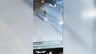 Woman Hit By Brick Wall After Bus Overturns - Video