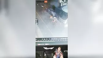 Woman Hit By Brick Wall After Bus Overturns - Video