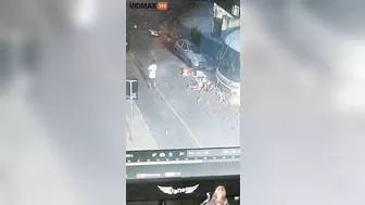 Woman Hit By Brick Wall After Bus Overturns - Video