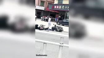 A Cyclist Without A Helmet Knocked Down Another Cyclist At An Intersection-01