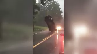 Car Stuck In Wires Looks Like It's Hanging In Mid-air
