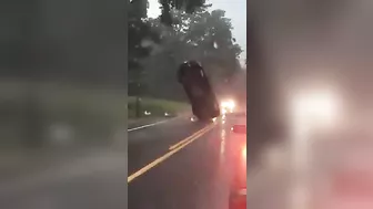 Car Stuck In Wires Looks Like It's Hanging In Mid-air