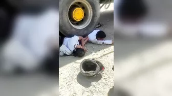 Couple On Motorcycle Falls Under Wheels Of Heavy Truck