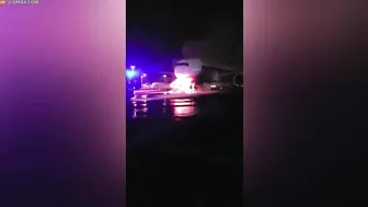 Firefighters Battle To Save Plane As Truck Tows Away Passenger Jet
