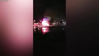 Firefighters Battle To Save Plane As Truck Tows Away Passenger Jet