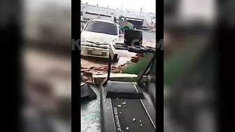 Man Crashes Car Into Glass Window