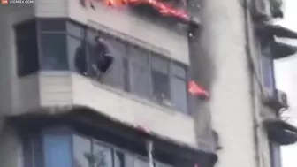 Heartbreaking Moment Man Clings To Burning Skyscraper