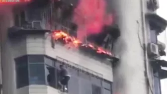 Heartbreaking Moment Man Clings To Burning Skyscraper