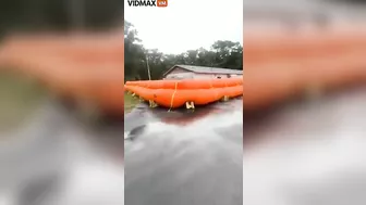 Homeowner Places Giant Flotation Devices Around His House To Prevent Flooding