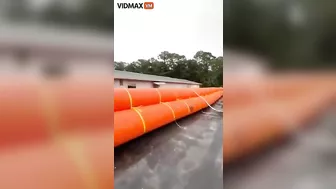 Homeowner Places Giant Flotation Devices Around His House To Prevent Flooding