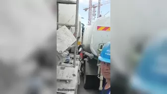 Man Trapped Between Trucks