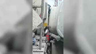 Man Trapped Between Trucks